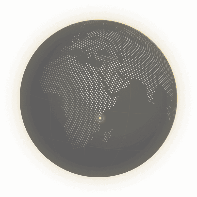 A dotted globe turned towards East Africa, with Zanzibar marked by a gold beacon