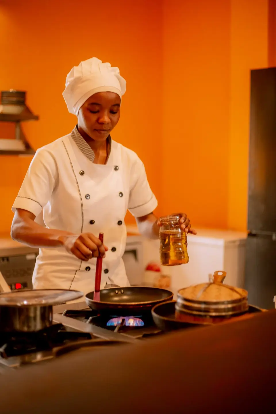 Bertha cooking authentic Vietnamese food, including Pho, for the Duyên by Kim menu at Boutique Hotel Matlai Zanzibar.